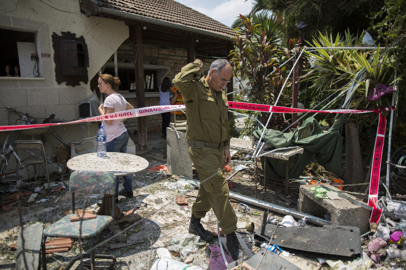 File Photo: Israeli home struck by a rocket fired from the Gaza Strip on the Israeli town of Yehud, on July 22, 2014, during Operation Protective Edge. Photo by Yonatan Sindel/Flash90