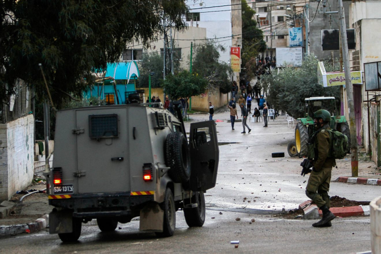 Palestinians clash with Israeli soldiers in the West Bank city of Jenin, Jan. 18, 2018. Photo by Nasser Ishtayeh/Flash90.