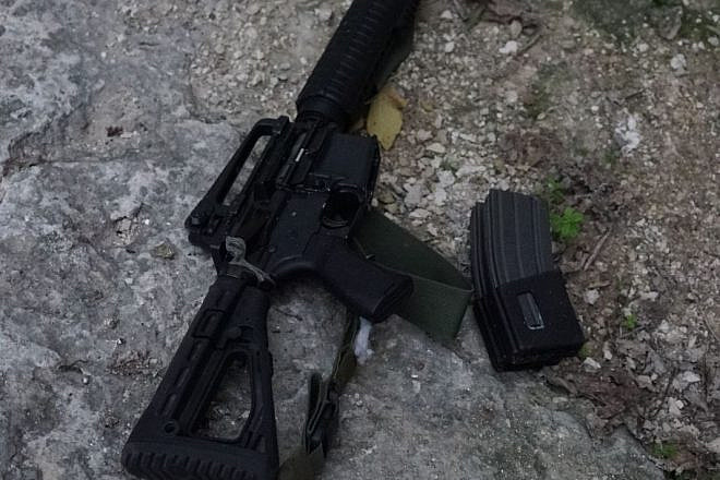 Weapons belonging to Ahmed Nassar Jarrar, the head of the Palestinian terror cell that on Jan. 9 murdered Israeli father of six and volunteer medic Rabbi Raziel Shevach. Credit: IDF via Twitter.