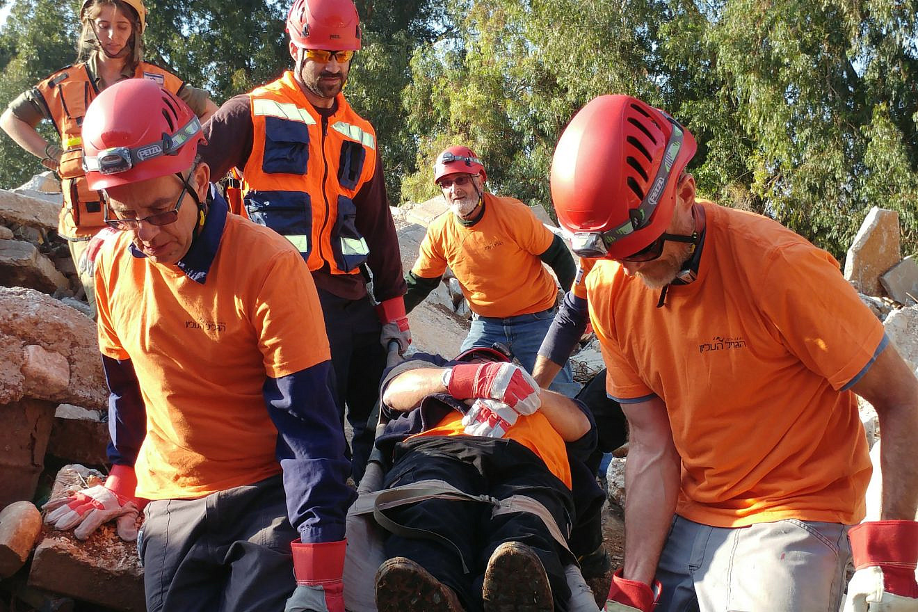 A rescue team from the Upper Galilee Regional Council trains evacuating the injured from wreckage. Credit: Aviv Leshem.