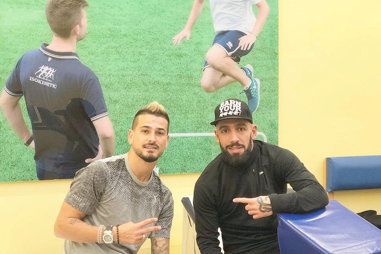 Maor Buzaglo, left, and Iran’s Ashkan Dejagah in a photo posted on Buzaglo’s Facebook page on March 18, 2018. Credit: Facebook.