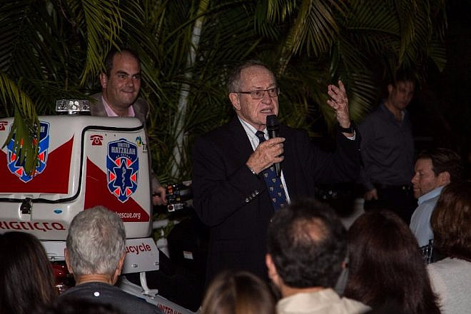Alan Dershowitz speaking at a ceremony highlighting his donation of a ambucycle to Israel’s volunteer medic organization, United Hatzalah. Credit: United Hatzalah.