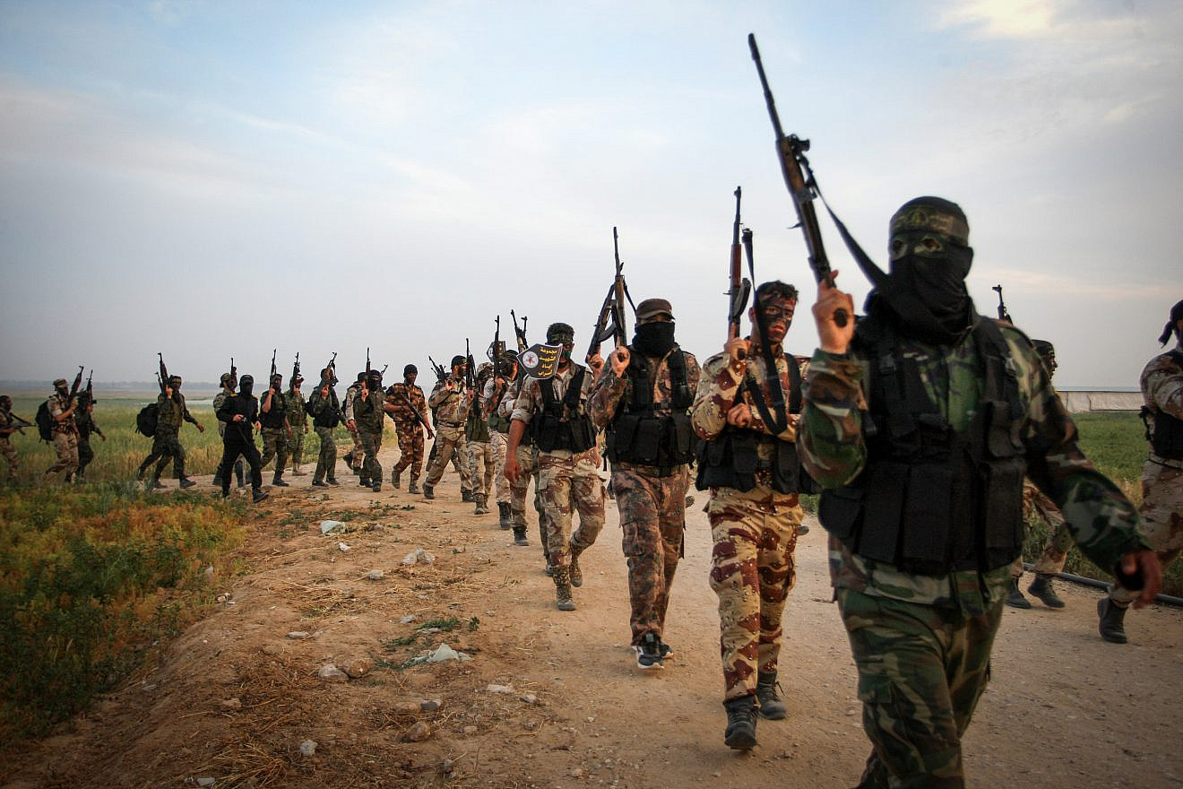Palestinian Islamic Jihad members march during a military drill near the border with Israel, east of the town of Khan Younis in the southern Gaza Strip, on March 27, 2018. Photo by Abed Rahim Khatib/Flash90.