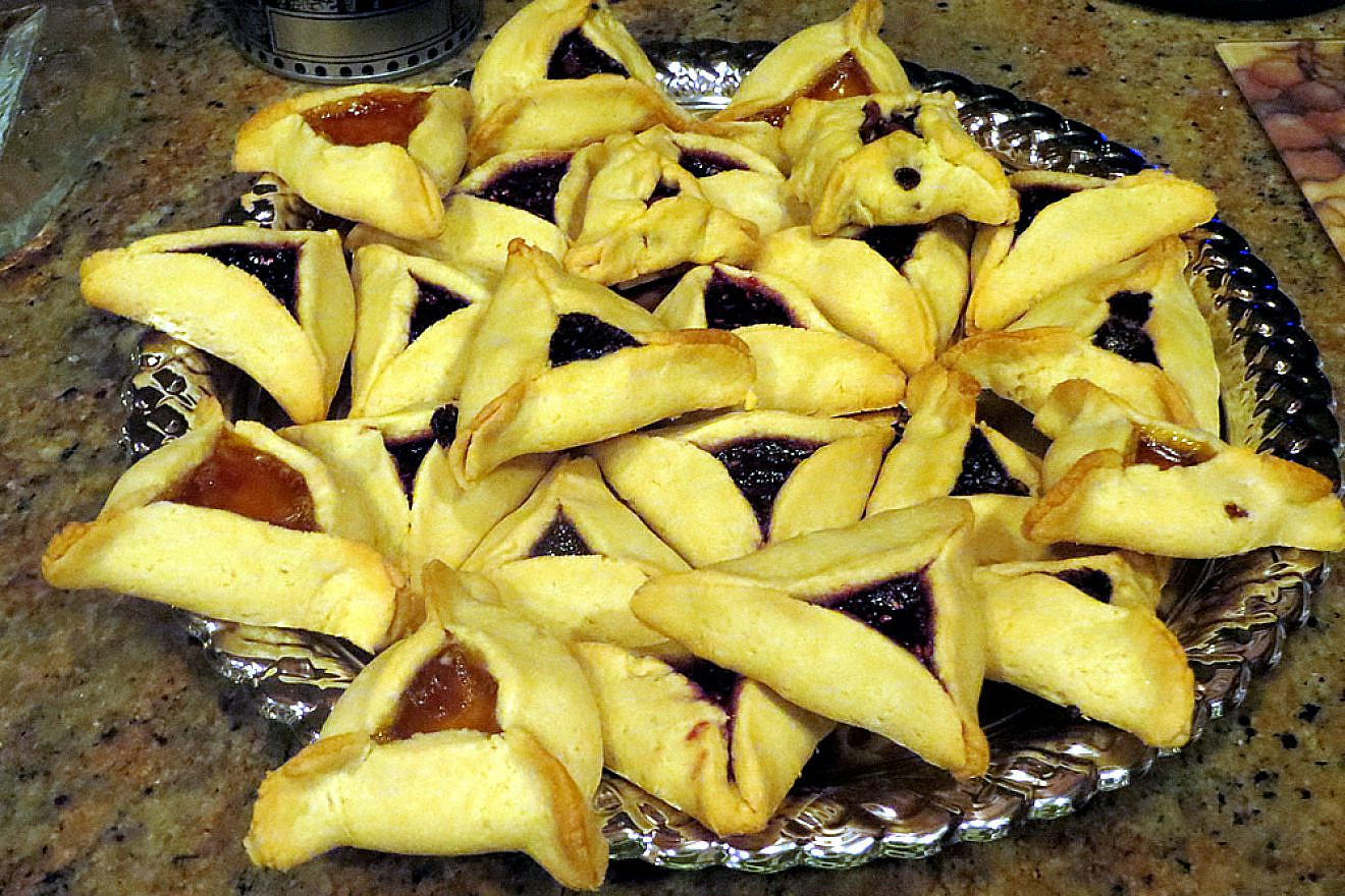 A three-cornered hamantashen, filled with fruit preserves, poppy seeds and even chocolate, commonly served during the Jewish holiday of Purim. Credit: Carin M. Smilk.