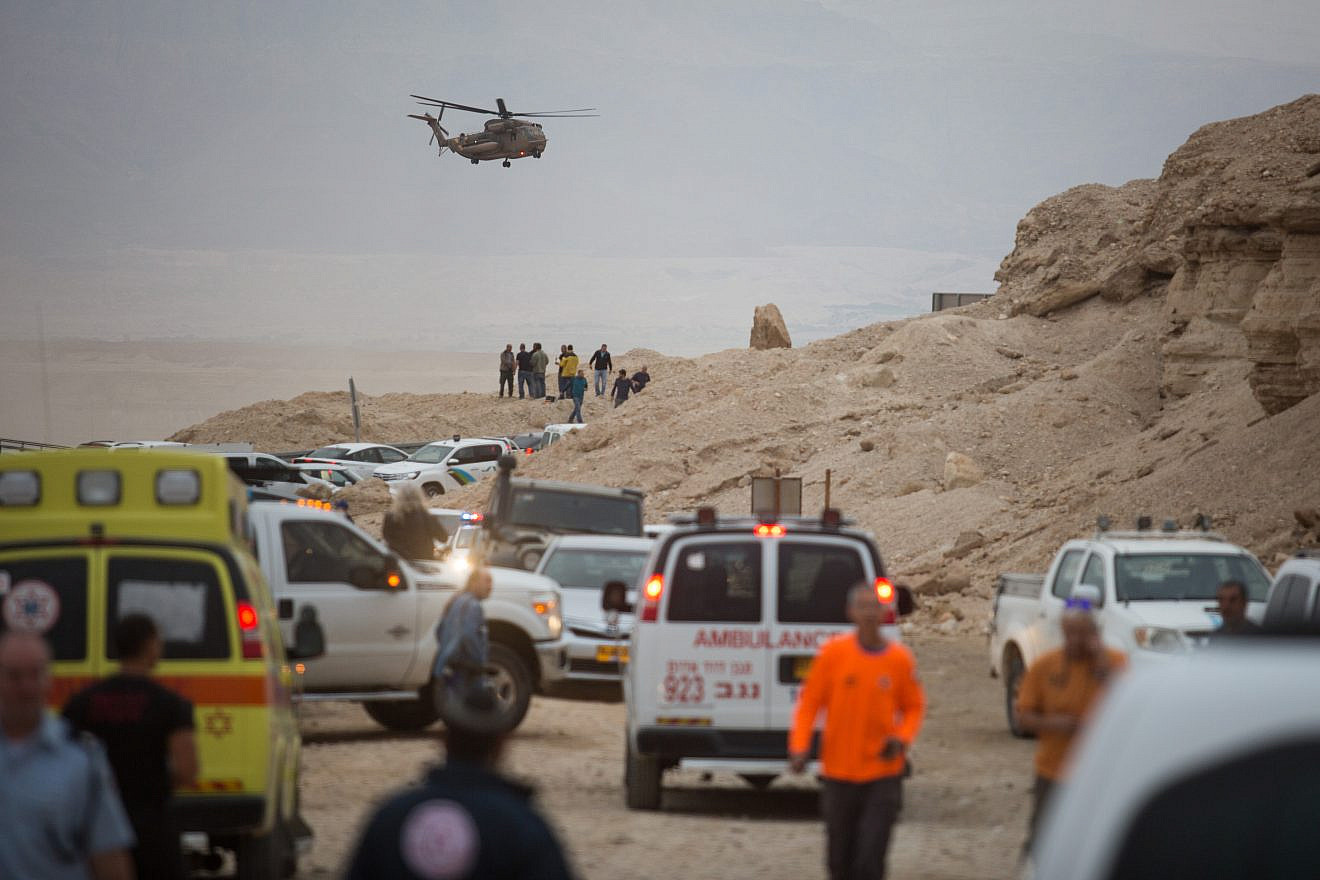Rescue forces near the scene where young Israelis were swept in the flooding of the Tzafit Stream near the Dead Sea on April 26, 2018. Heavy rainfall caused flooding across the desert, causing many streams to overflow. Photo by Hadas Parush/Flash90.