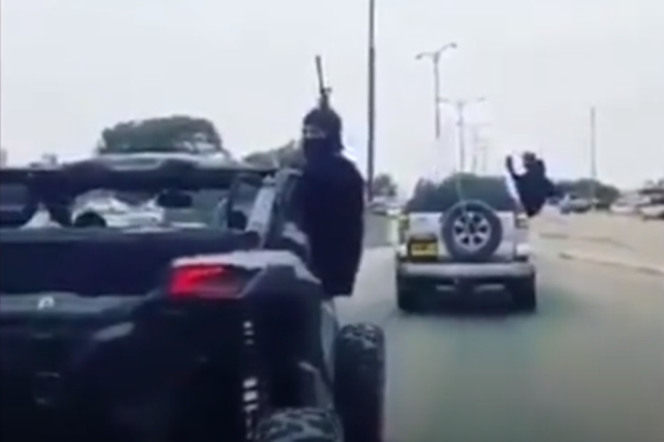 Bedouin wedding celebrants shoot M-16s in the air on an Israeli road. Source: Screenshot.