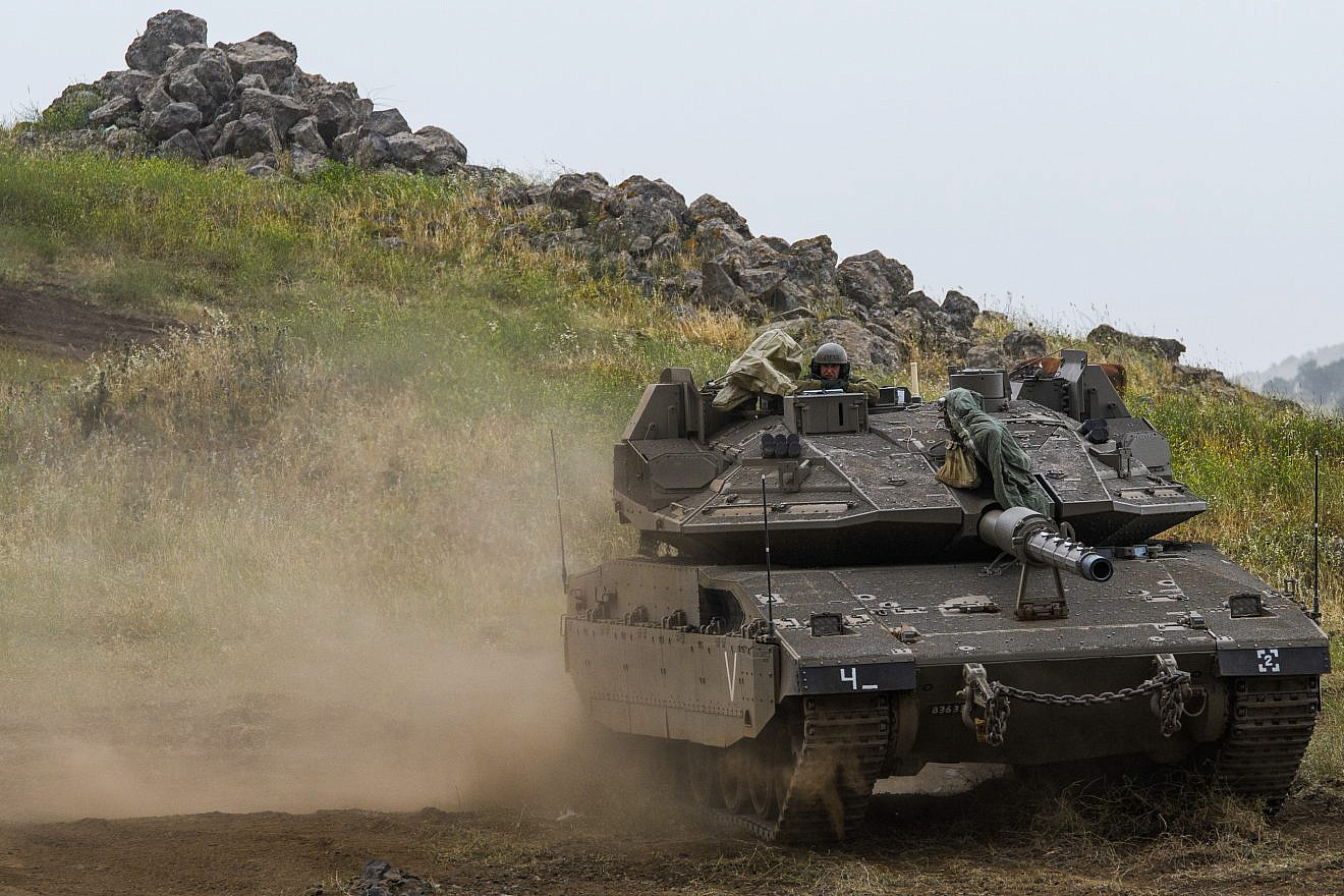 Israeli soldiers seen near the Israeli-Syrian border in the Golan Heights on May 7, 2018. Credit: Basel Awidat/Flash90.