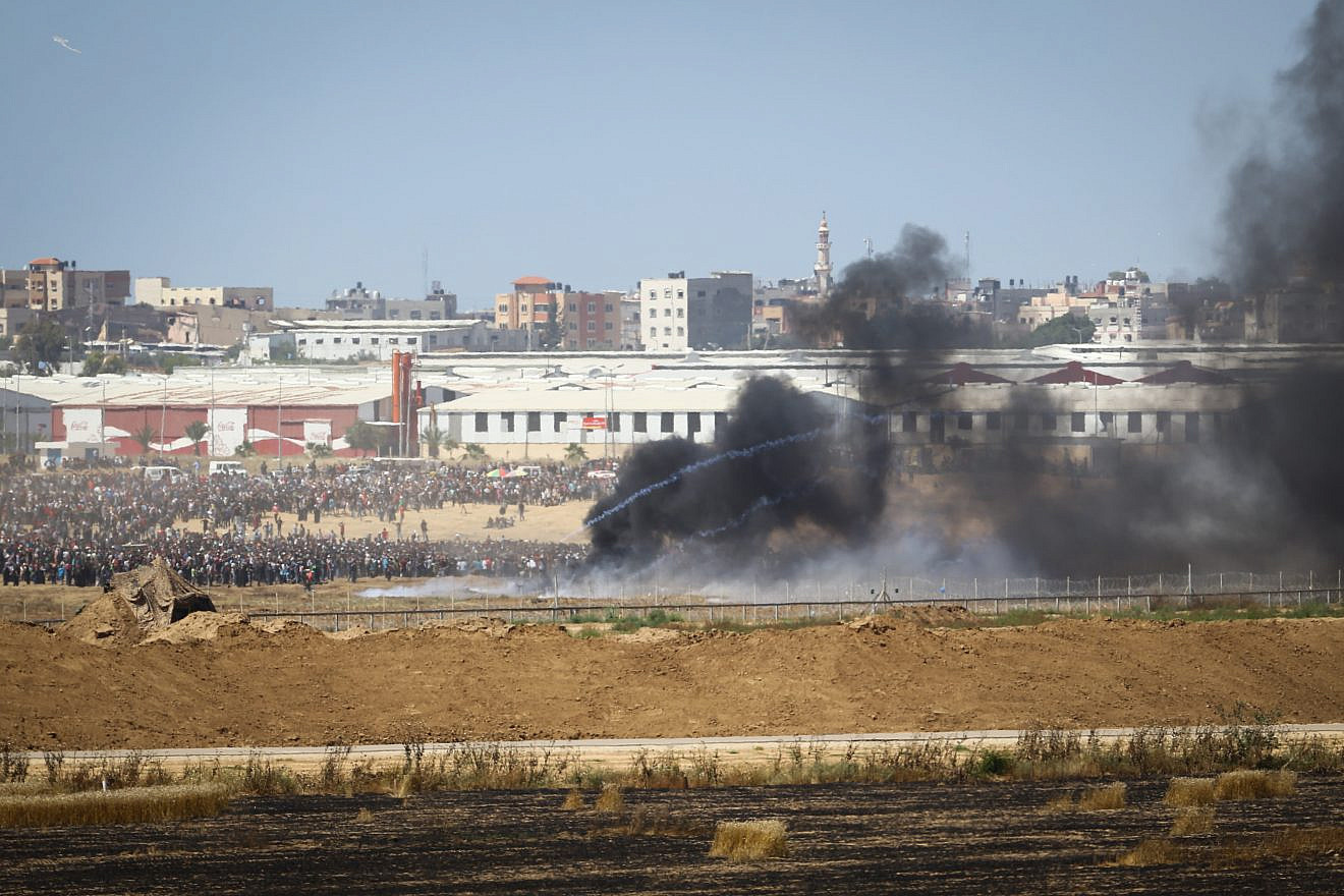Thousands of Palestinians protest by the border fence, as seen from the Israeli side, on the same day that the new U.S. embassy opened in Jerusalem on May 14, 2018. Photo by Flash90.