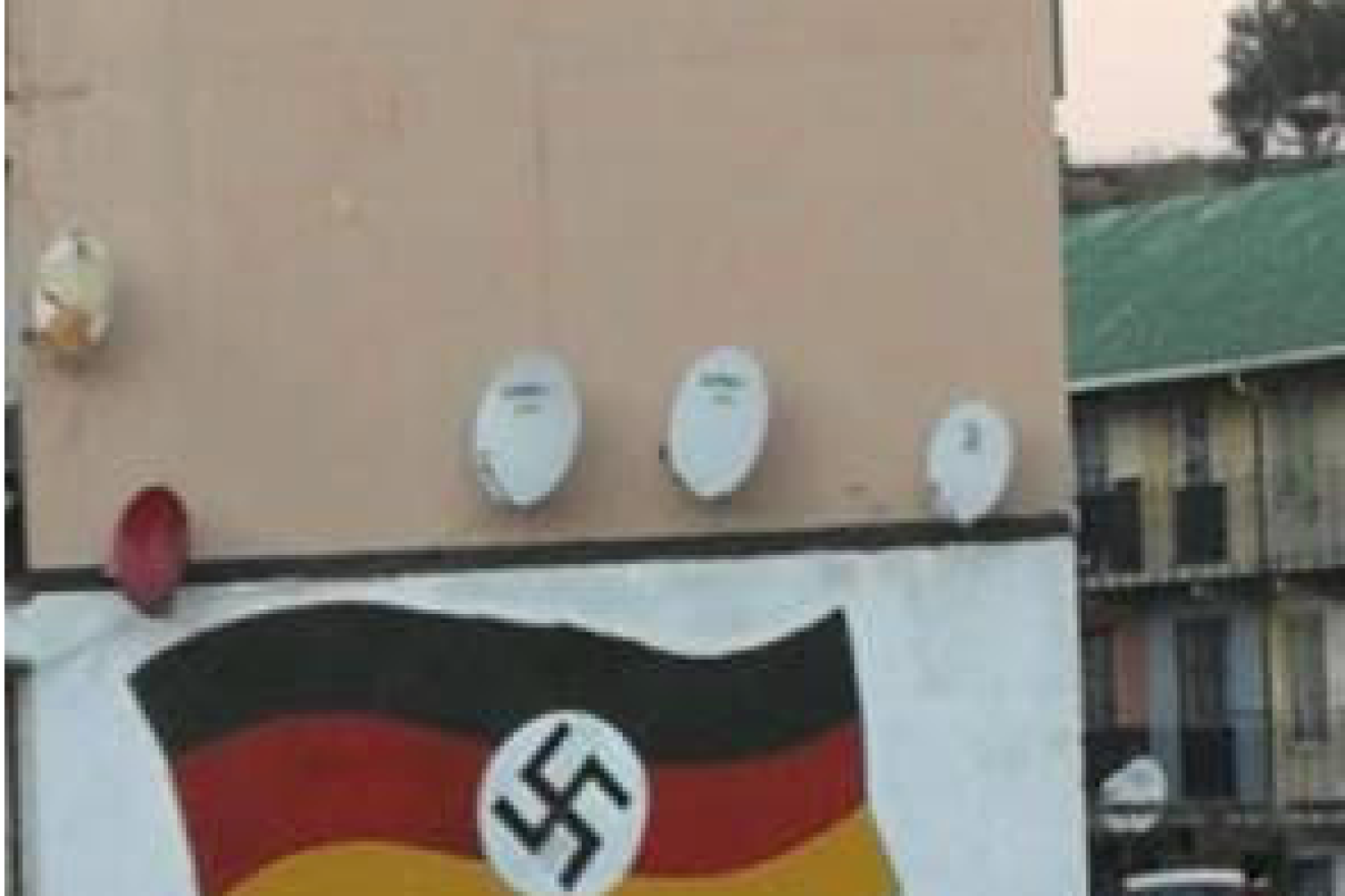 A mural with a Germany flag, with a swastika inserted in it, that appeared in Johannesburg, South Africa. this week amid an uptick in anti-Semitic attacks. Credit: Facebook.
