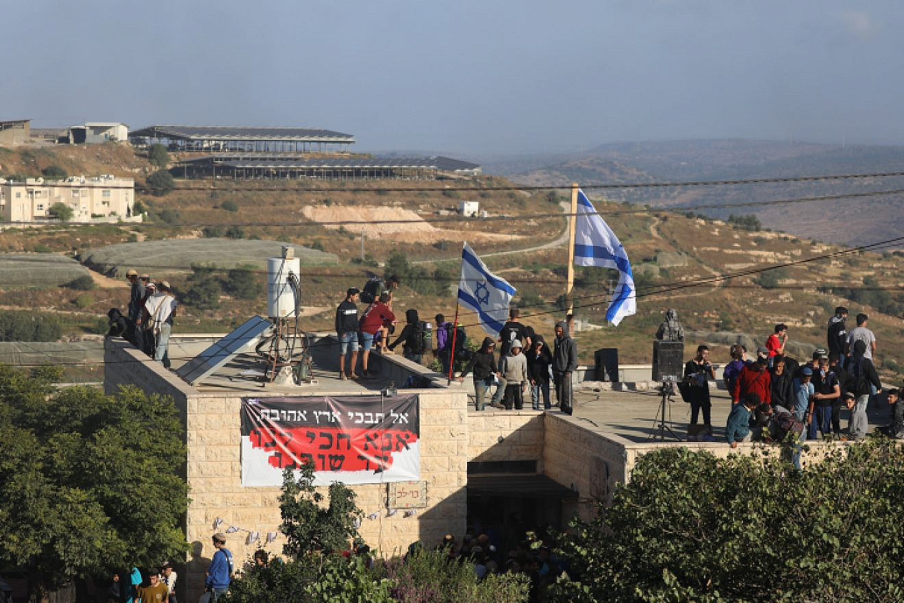 People at the illegal Jewish neighborhood of Netiv Ha’avot in Gush Etzion, ahead of the eviction of the neighborhood on June 12, 2018. Photo by Yonatan Sindel/Flash90.