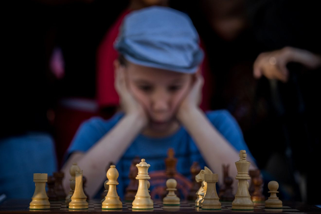 A young Israeli chess player takes part in a special chess tournament in Jerusalem marking Israel’s 70th anniversary, April 30, 2018. Photo by Yonatan Sindel/Flash90.