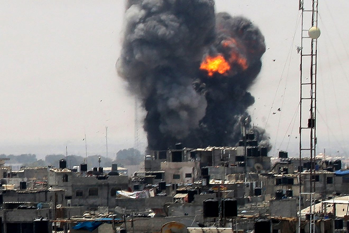 Smoke and fire rise from a location reportedly belonging to Hamas, following an Israeli airstrike in the southern Gaza town of Rafah on July 14, 2018. Photo by Abed Rahim Khatib/Flash90.