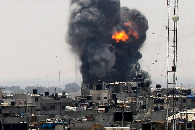 Smoke and fire rise from a location reportedly belonging to Hamas, following an Israeli airstrike in the southern Gaza town of Rafah on July 14, 2018. Photo by Abed Rahim Khatib/Flash90.