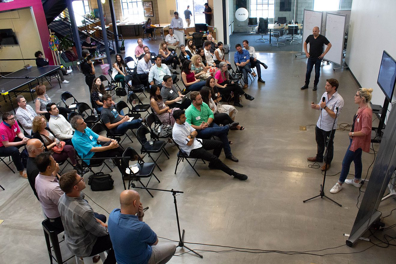 Ron Biton and Shiran Schmerling, participants in the IDEAS Immersion program, present their startup platforms to L.A.-based companies and the community. Credit: Harmony Wedding Photography.