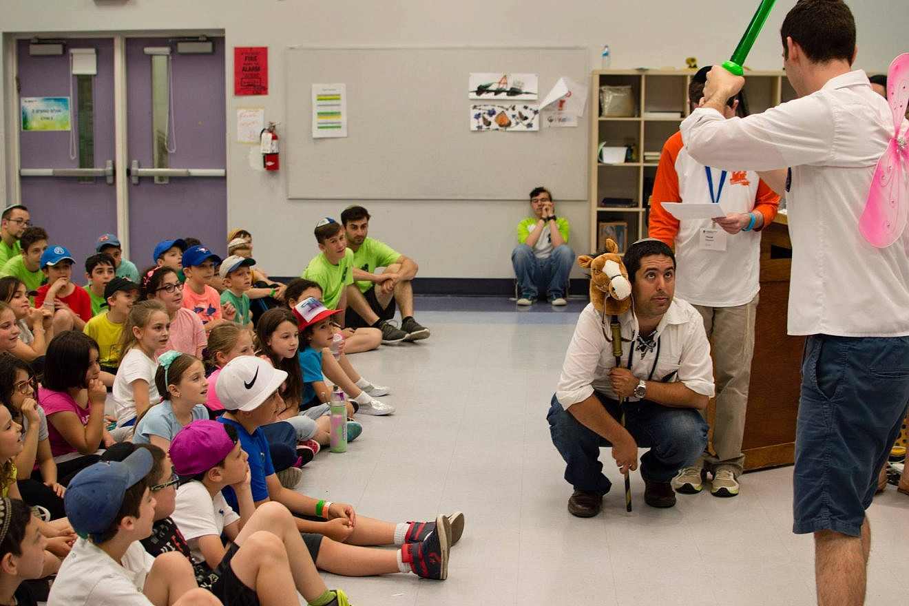 Children watch camp counselors perform at Camp Moshava in Toronto, Canada. Photo by Ariel Marcus.