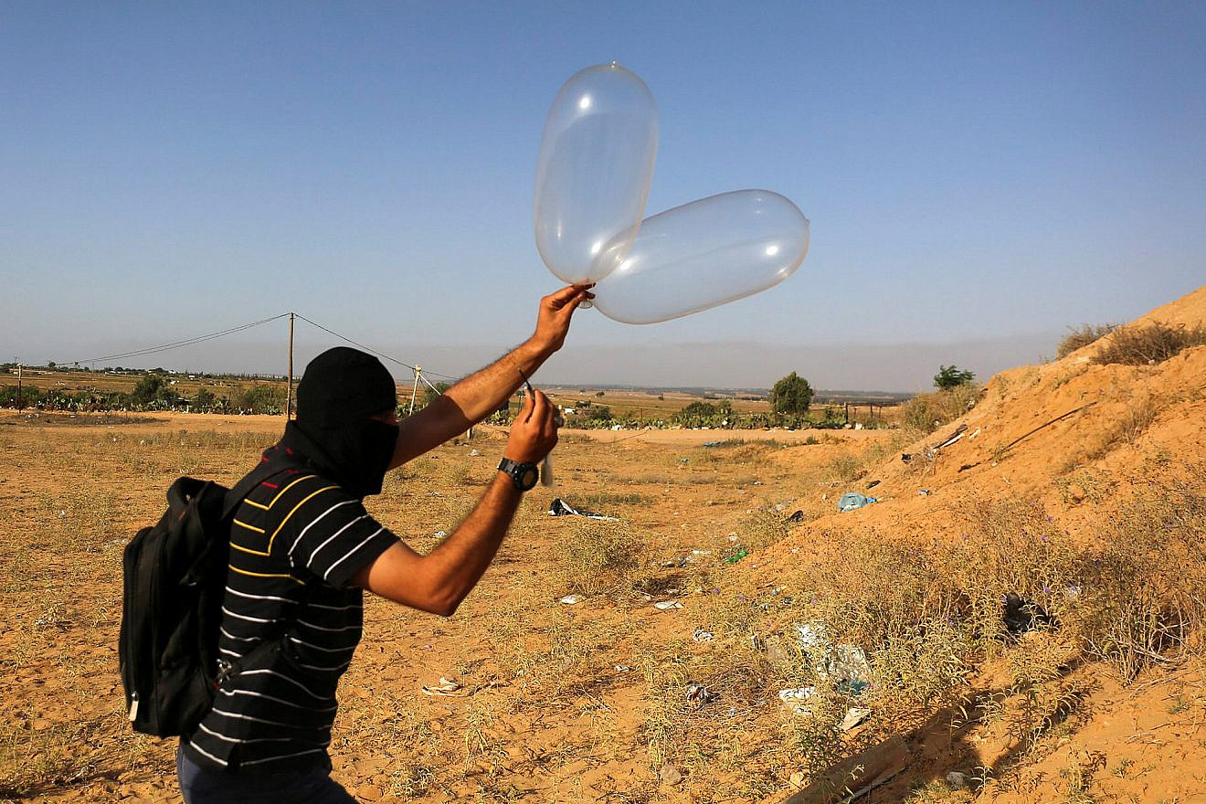 Palestinians prepare a balloon that will be attached to flammable materials to be flown towards Israel near the Israeli Gaza border, in Rafah in the southern Gaza Strip on June 17, 2018. Photo by Abed Rahim Khatib/Flash90.