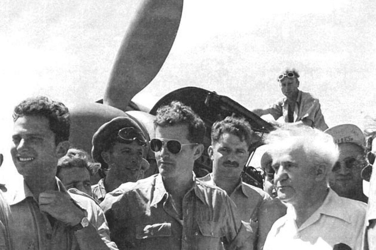 Former Israeli Prime Minister David Ben-Gurion (right) visits the “Machal 101” air squadron. Pilot Gideon Lichtman is pictured at the far left. Credit: Wikimedia Commons.
