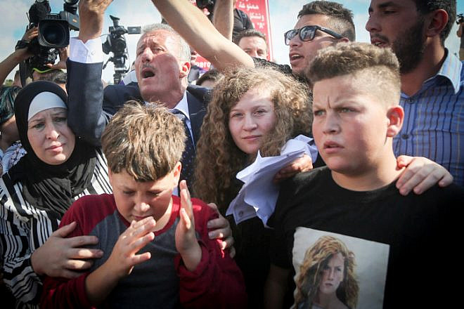 Palestinian teenager Ahed Tamimi is welcomed by relatives and supporters after she was released from prison in Israel on July 29, 2018. Photo by Flash90.