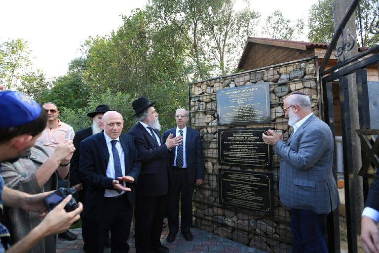 Unveiling a plaque at the newly restored Jewish cemetery in Lubavitch, Russia—the cradle of the Chabad-Lubavitch movement. Credit: ESJF.
