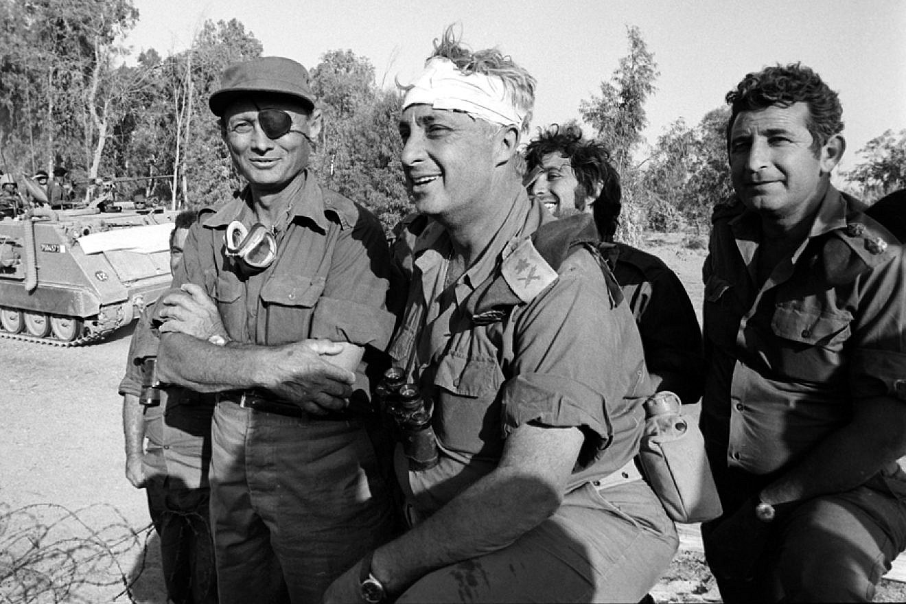 Israeli Defense Minister Moshe Dayan (left) with injured field commander and war strategist Ariel Sharon (center) during the 1973 Yom Kippur War. Credit: The Israel Defense Forces Archive Pikiwiki Israel via Wikimedia Commons.