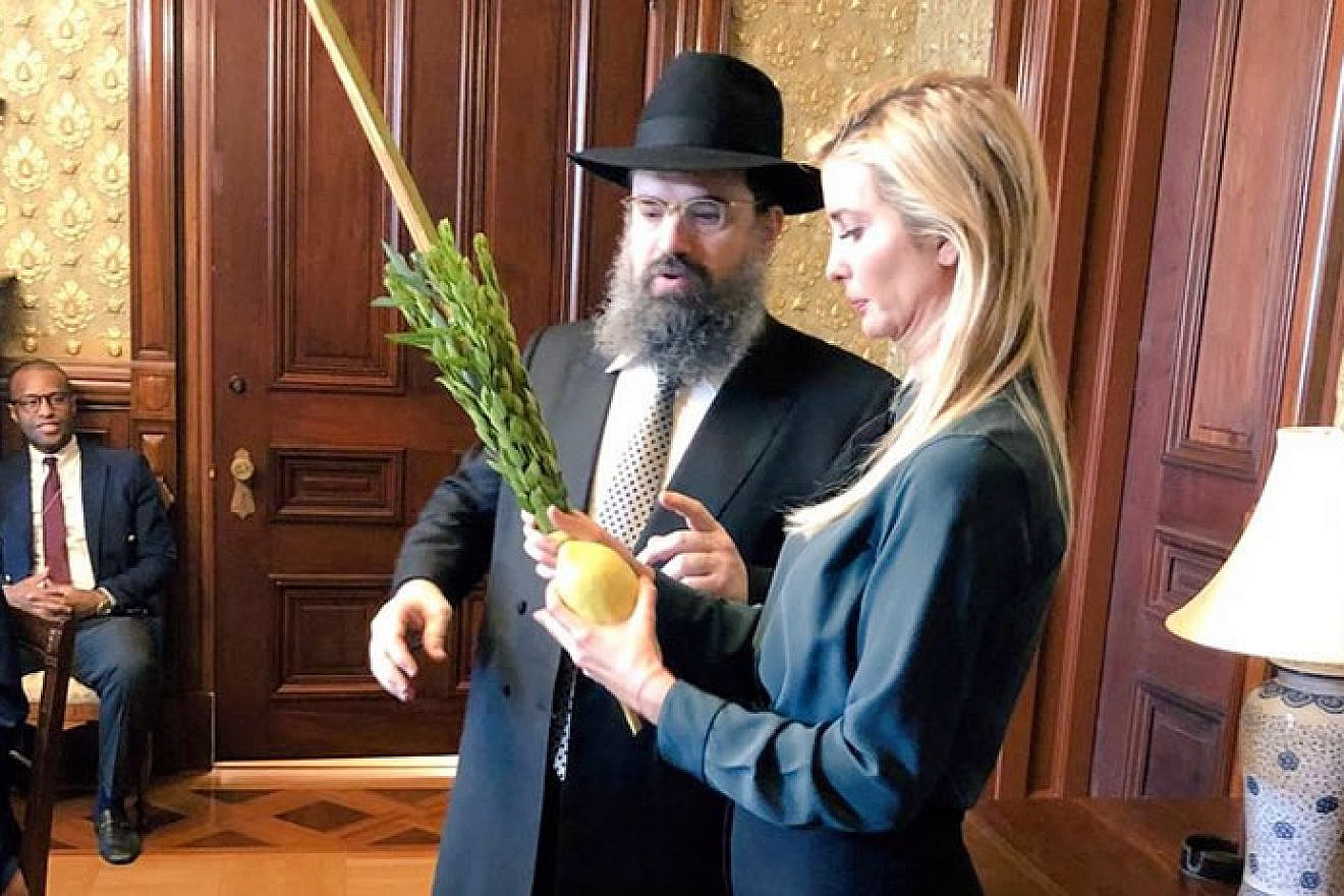Ivanka Trump is assisted waving the lulav and etrog at the White House during the eight-day holiday of Sukkot by Rabbi Levi Shemtov, executive vice president of American Friends of Lubavitch (Chabad). Source: Twitter.