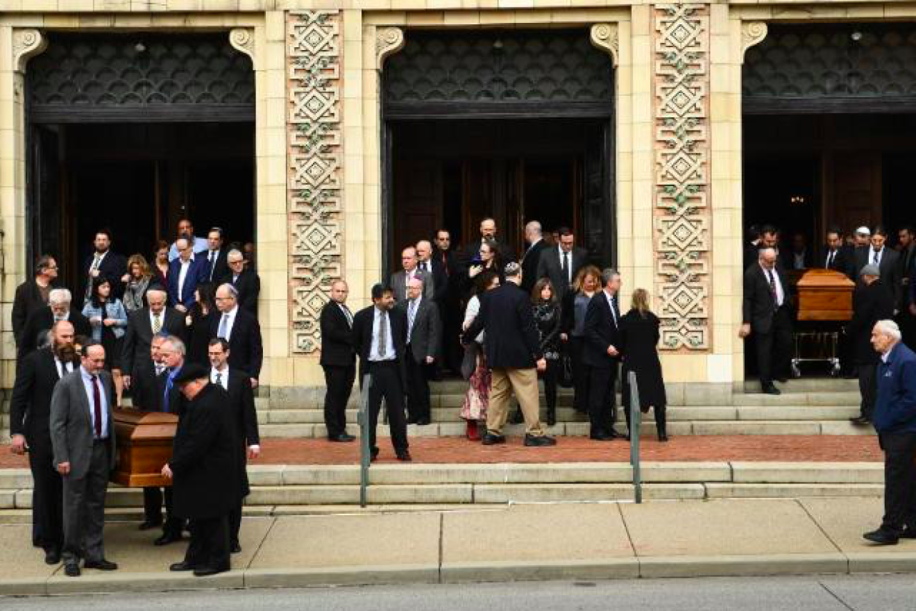 Caskets are carried outside of Rodef Shalom Congregation, the scene of the funeral for brothers Cecil and David Rosenthal, two of the 11 Jewish worshippers shot and killed on Oct. 27, 2018 at the Tree of Life*Or L’Simcha Synagogue in the Squirrel Hill neighborhood of Pittsburgh. Source: Screenshot.
