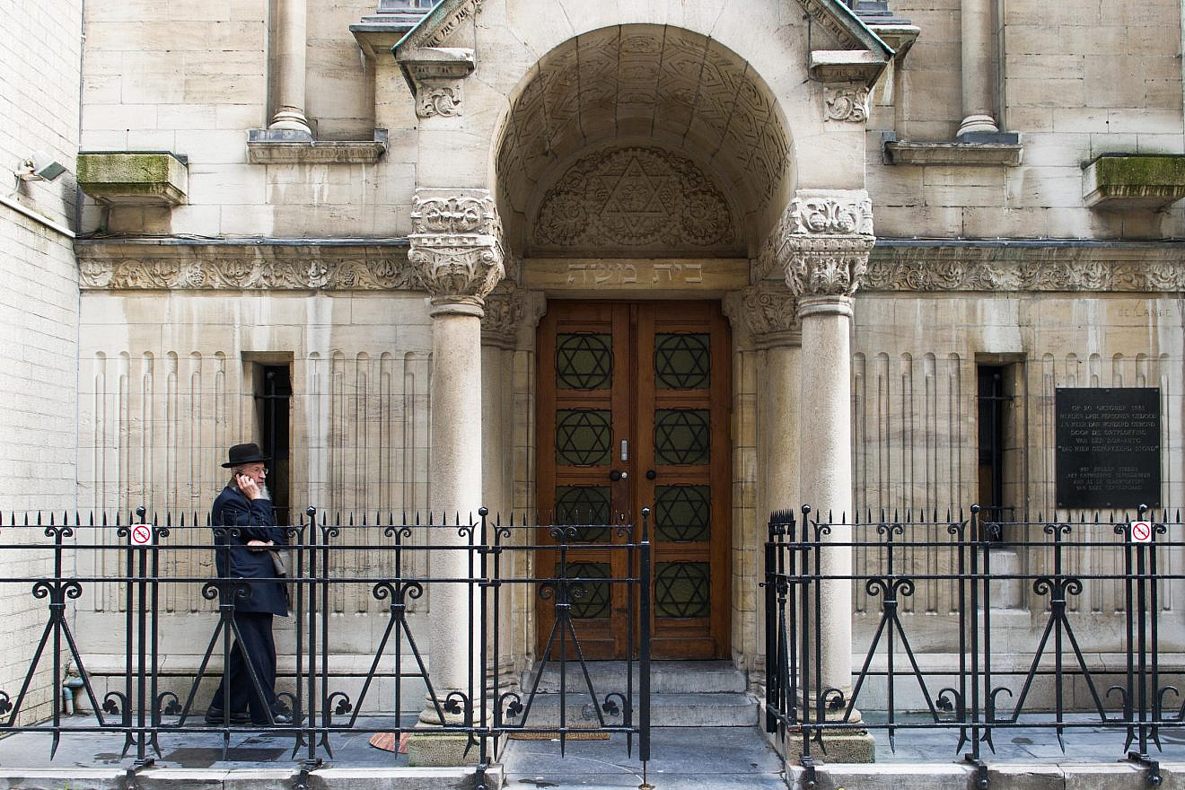 An Orthodox Jewish man outside a synagogue in the Jewish Quarter in Antwerp, Belgium, on Dec. 9, 2014. Photo by Johanna Geron/Flash90.