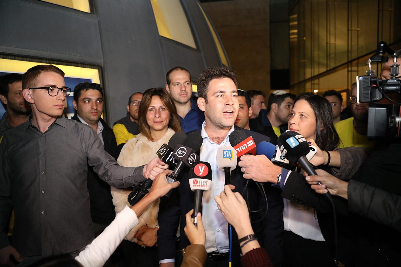 Supporters celebrate as Jerusalem mayoral candidate Ofer Berkovich arrives at his campaign headquarters as he leads the early counting in the Municipal Elections for Jerusalem on Oct. 30, 2018. Photo by Noam Revkin Fenton/Flash90.