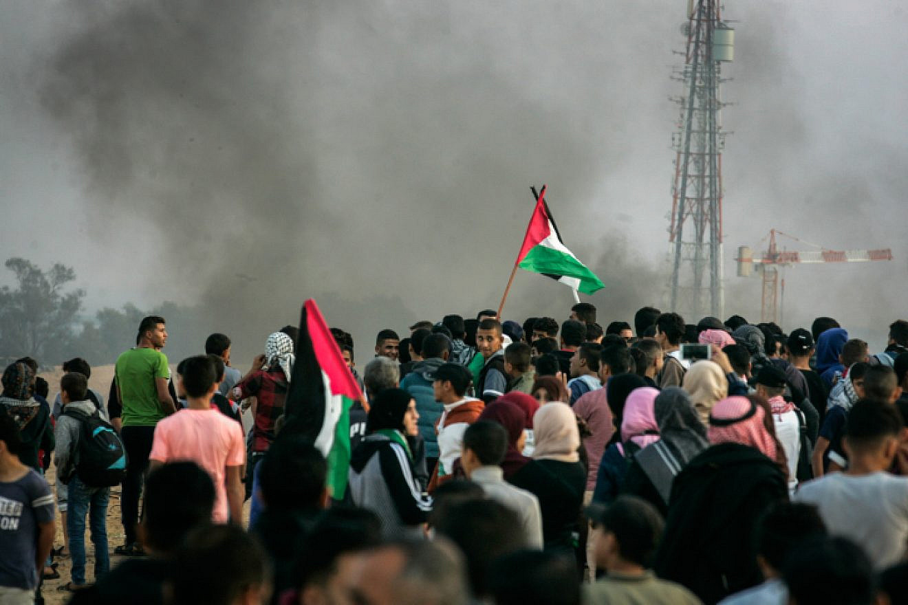 Palestinians take part in a “March of Return” demonstration near Al Bureij Refugee Camp on the Gaza-Israel border, in east of Rafah in the southern Gaza Strip, on Nov. 9, 2018. Photo by Abed Rahim Khatib/Flash90.