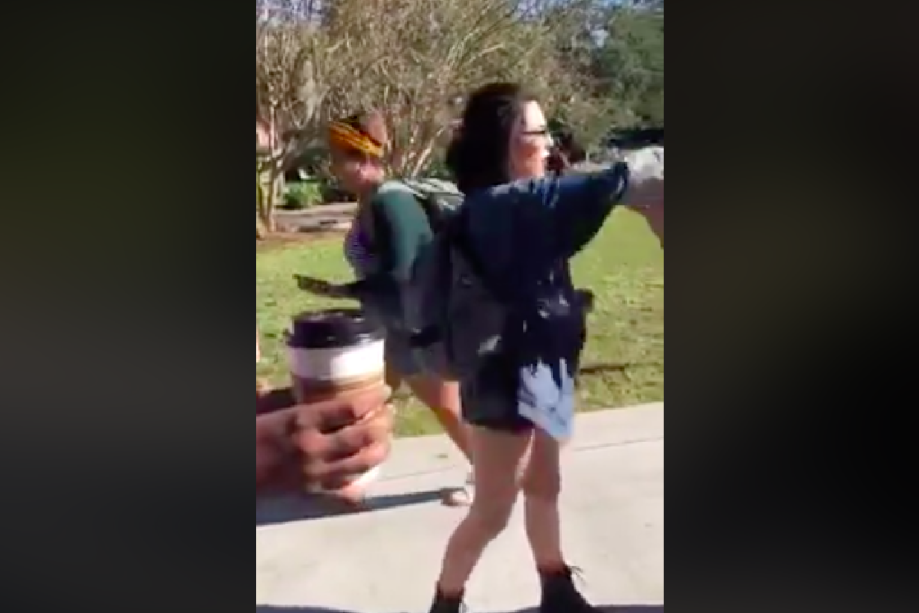 Shelby Shoup, an intern for Democratic gubernatorial nominee Andrew Gillum’s campaign and a member of FSU's Students for Justice in Palestine, was arrested and charged with battery for throwing chocolate milk at a group of college Republicans tabling on campus. Credit: Screenshot.
