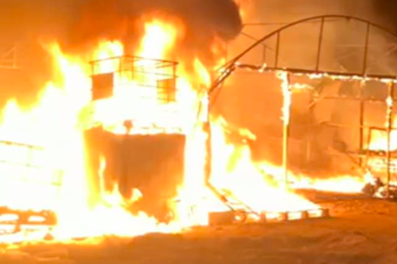 A fire rages in a greenhouse near the Gaza border on Oct. 9, 2018. Credit: Screenshot.