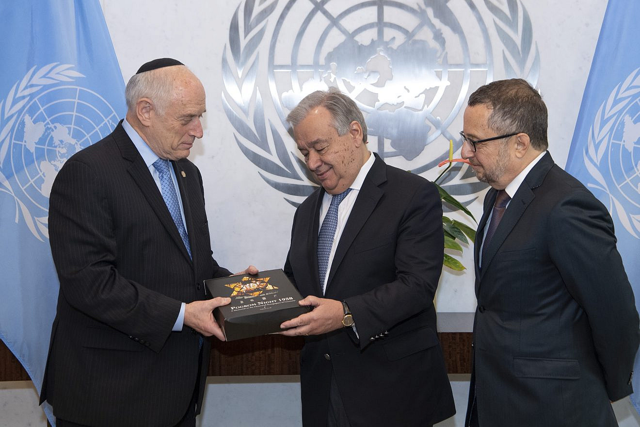 Malcolm Hoenlein (left), CEO and vice chair of the Conference of Presidents, presents a two-volume set of books titled “Pogrom Night 1938” to U.N. Secretary General António Guterres. Credit: Conference of Presidents of Major American Jewish Organizations.