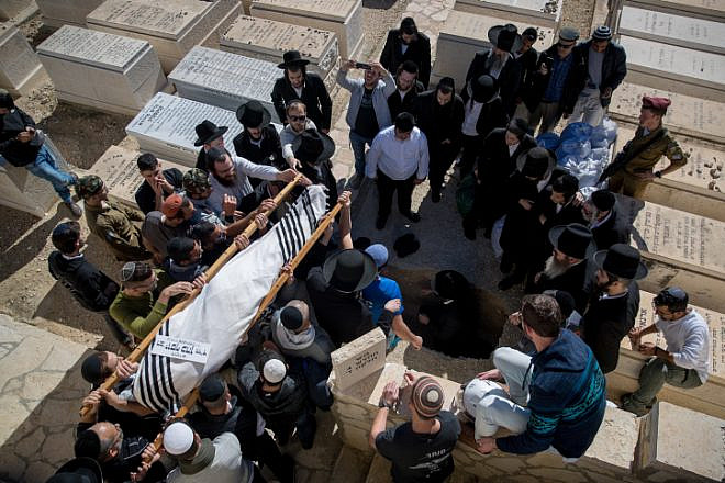 Friends and family members mourn during the funeral of Israeli soldier Yosef Cohen at the Mount of Olives cemetery in Jerusalem, on Dec. 14, 2018. Sgt. Yosef Cohen and Sgt. Yuval Mor Yosef were killed in a shooting terror attack at the entrance to the Israeli town of Givat Asaf in southern Samaria the day beforehand. Photo by Yonatan Sindel/Flash90.