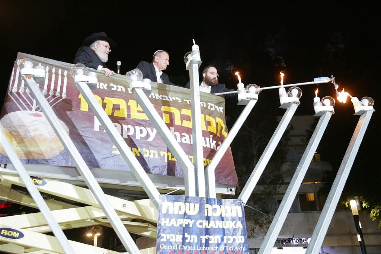 Ron Huldai, the mayor of Tel Aviv-Yafo, inaugurated the renewed Dizengoff Square in Tel Aviv by lighting the fourth Hanukkah candle of the central Chabad menorah, together with Rabbi Joseph Gerlitzky. Dec. 5, 2018.