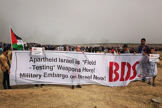 Palestinians who support boycotting Israel during clashes along the Israel-Gaza border in May 2018. Credit: BDS National Committee via Facebook.