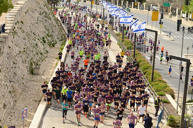 Thousands of runners take part in the 2018 international Jerusalem Marathon in Jaffa Gate in Jerusalem's Old City on March 9, 2018. Photo by Mendy Hechtman/Flash90.