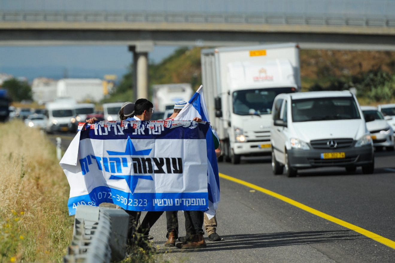 Right-wing activists and members of Otzma Yehudit movement seen at Eyal Interchange after the police stopped their bus on their way to protest in Umm al-Fahm, April 10, 2018. Photo by Basel Awidat/Flash90.