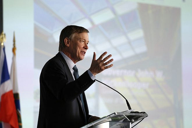 Then-Colorado Gov. John Hickenlooper speaks at the U.S. Department of Energy Solar Decathlon 2017 opening ceremony at the 61st & Peña Station in Denver on Oct. 5, 2017. Credit: Jack Dempsey/U.S. Department of Energy Solar Decathlon.