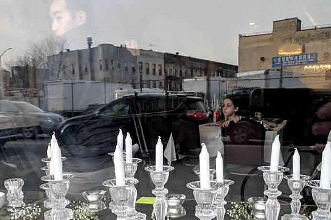 One week after an attack on the Chabad House in the Bushwick neighborhood of Brooklyn, 150 community members, local residents and visitors unite to respond to hatred with light. Credit: Chabad.org/News.