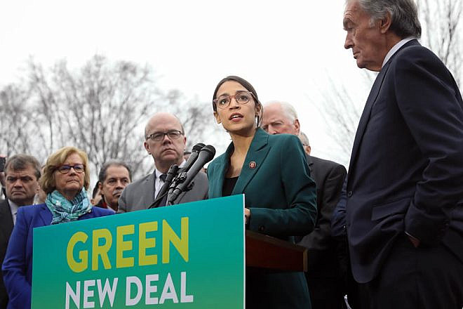Rep. Alexandria Ocasio-Cortez (D-N.Y.) speaks on the Green New Deal with Sen. Ed Markey (D-Mass.) to her right in front of the Capitol Building in Washington, D.C., on Feb. 7 2019. Credit: Wikimedia Commons.