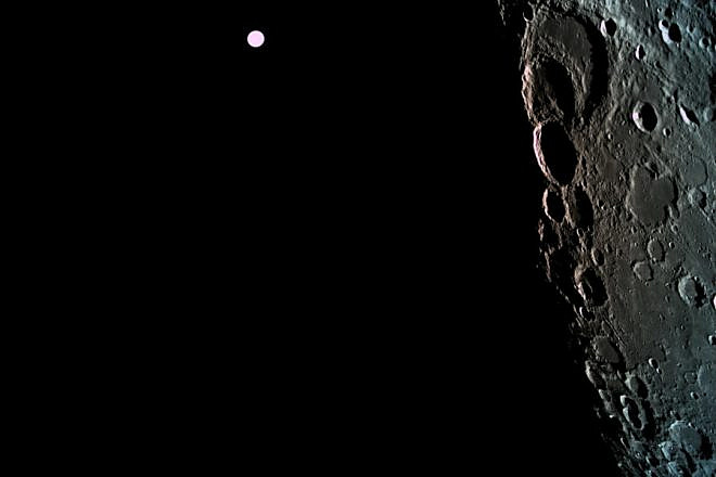 The surface of the moon as captured by the Israeli spacecraft “Beresheet” with the Earth in the background. Credit: “Beresheet.”