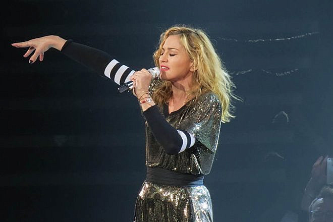 Madonna performing during her MDNA Tour 2012 at Key Arena in Seattle. Credit: Ronald Woan via Wikimedia Commons.