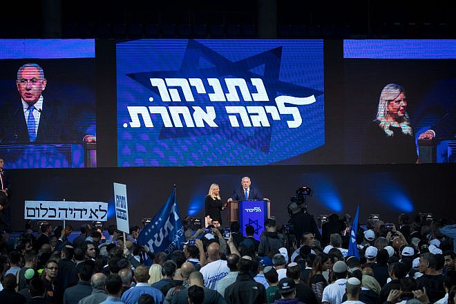 Israeli Prime Minister Benjamin Netanyahu, with his wife, Sara, next to him, addresses supporters as the the results of Israel's national elections are announced at party headquarters in Tel Aviv on April 9, 2019. Photo by Yonatan Sindel/Flash90.