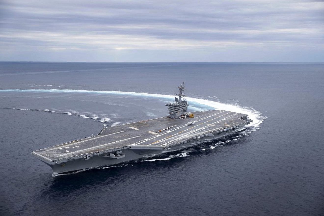 The Nimitz-class aircraft carrier “USS Abraham Lincoln” conducts high-speed turn drills in the Atlantic Ocean during sea trials. Photo by Juan A. Cuban/U.S. Navy.
