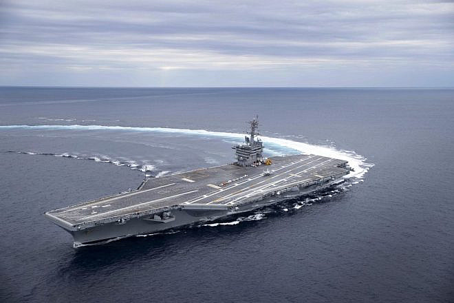 The Nimitz-class aircraft carrier “USS Abraham Lincoln” conducts high-speed turn drills in the Atlantic Ocean during sea trials. Photo by Juan A. Cuban/U.S. Navy.