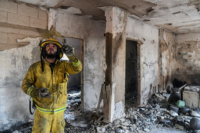 Firefighters extinguish the remains of a fire in in Mevo Modi'im on May 24, 2019. Photo by Avi Dishi/Flash90.