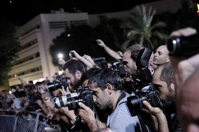 Photojournalists capture protests in central Tel Aviv against a controversial agreement reached over the past few months between the government and large energy companies over natural-gas production, Nov. 14, 2015. Photo by Tomer Neuberg/Flash90.