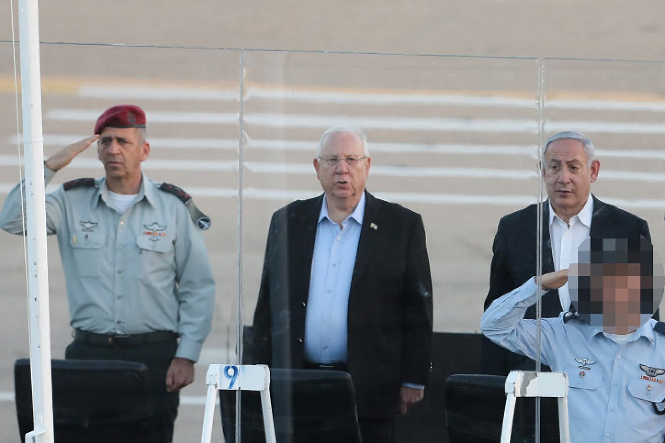 Israel Defense Forces' Chief of Staff Aviv Kochavi (left), Israeli President Reuven Rivlin (center) and Israeli Prime Minister Benjamin Netanyahu at a graduation ceremony for soldiers who have completed the IAF Flight Course at the Hatzerim Air Base, June 27, 2019. Photo by Flash90.