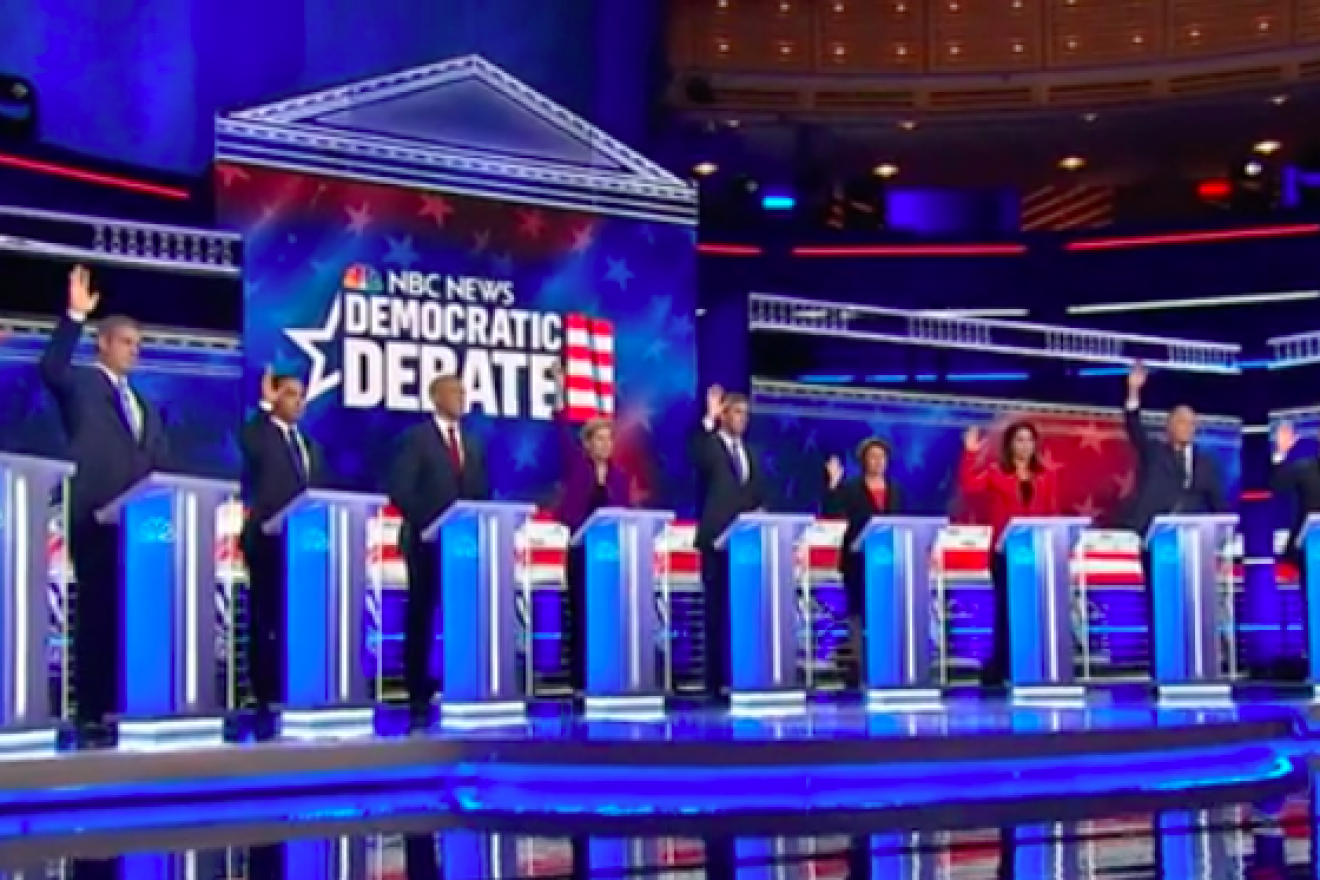 During the first Democratic presidential primary debate on June 26, 2019, when asked by moderator and “NBC Nightly News” anchor Lester Holt who, if elected, would re-enter the United States in the 2015 Iran nuclear deal, all but New Jersey Sen. Cory Booker raised a hand. Credit: Screenshot.