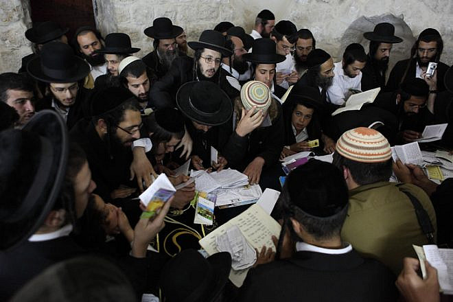 Jewish men pray at Joseph’s Tomb in Shechem/Nablus on July 4, 2011. Believed to be the final resting place of the biblical patriach Joseph, the area continually draws worshippers, who are often met by violence. Photo by Yaakov Naumi/Flash90.
